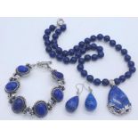 A Lapis Lazuli Suite Comprising of Necklace with Drop Pendant - 42cm and 4cm. Decorative oval