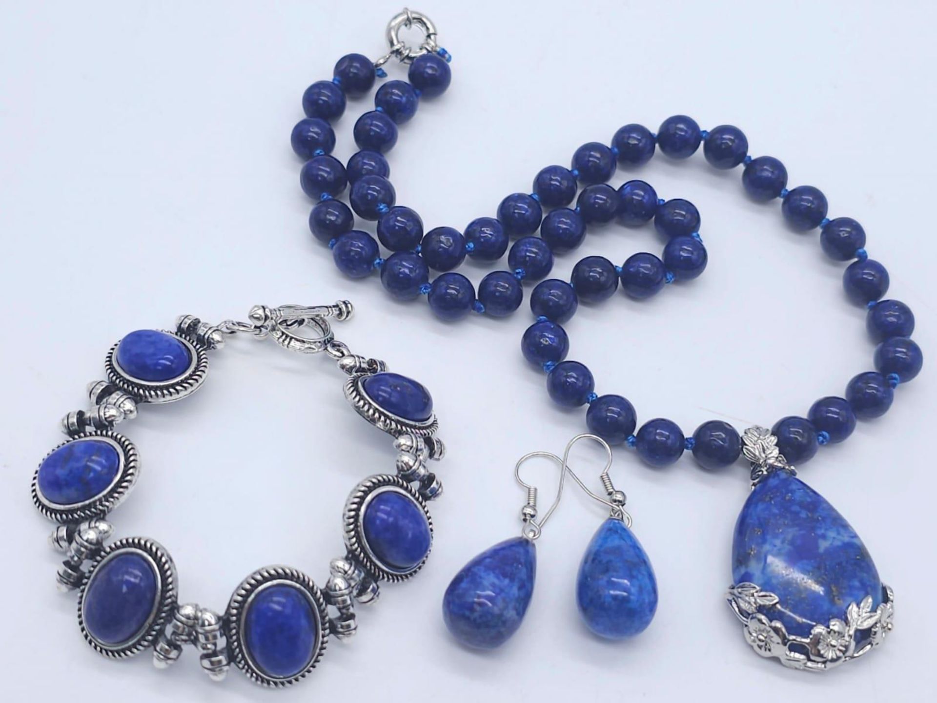 A Lapis Lazuli Suite Comprising of Necklace with Drop Pendant - 42cm and 4cm. Decorative oval