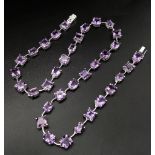 An Amethyst Gemstone Tennis Necklace set in 925 Silver. 46cm length. Square and oval shapes. 32.