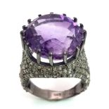 An Electrifying 17ct Amethyst with 2.20ct of Diamond Accents Ring. A beautiful round cut amethyst