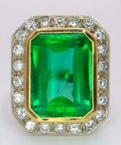 AN EXQUISITE 7.6ct COLOMBIAN OCTAGONAL CUT EMERALD SURROUNDED BY A HALO OF FINE QUALITY DIAMONDS