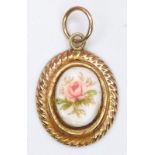 A Delicate 9K Gold and Floral Enamel Pendant/Charm. 16mm. 0.45g