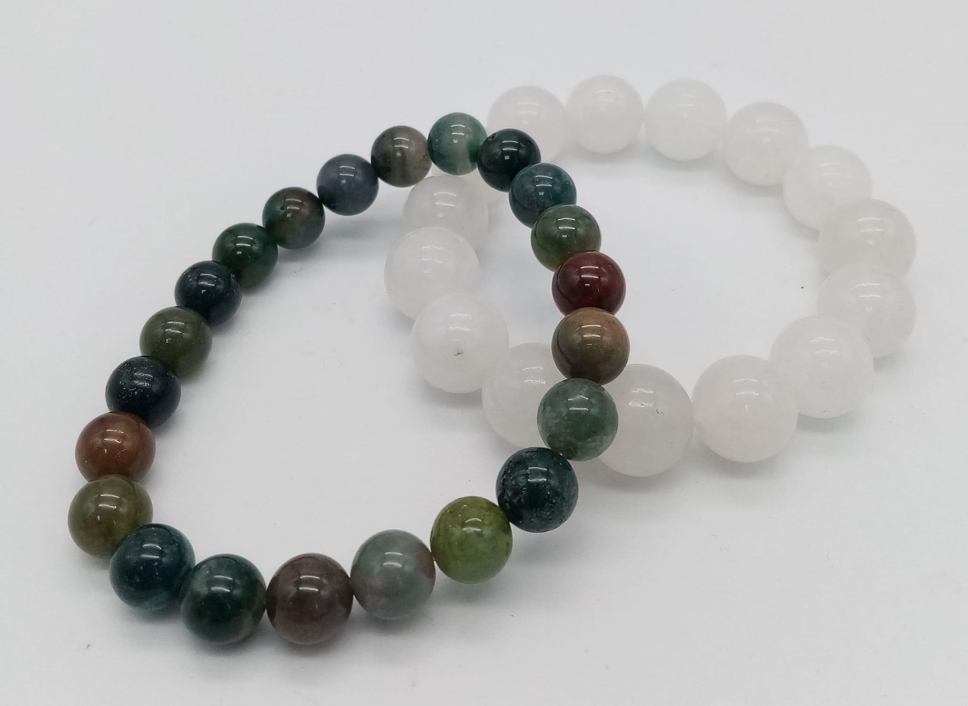 Two natural stone beaded stretch bracelets. Both measure 7cm in diameter.