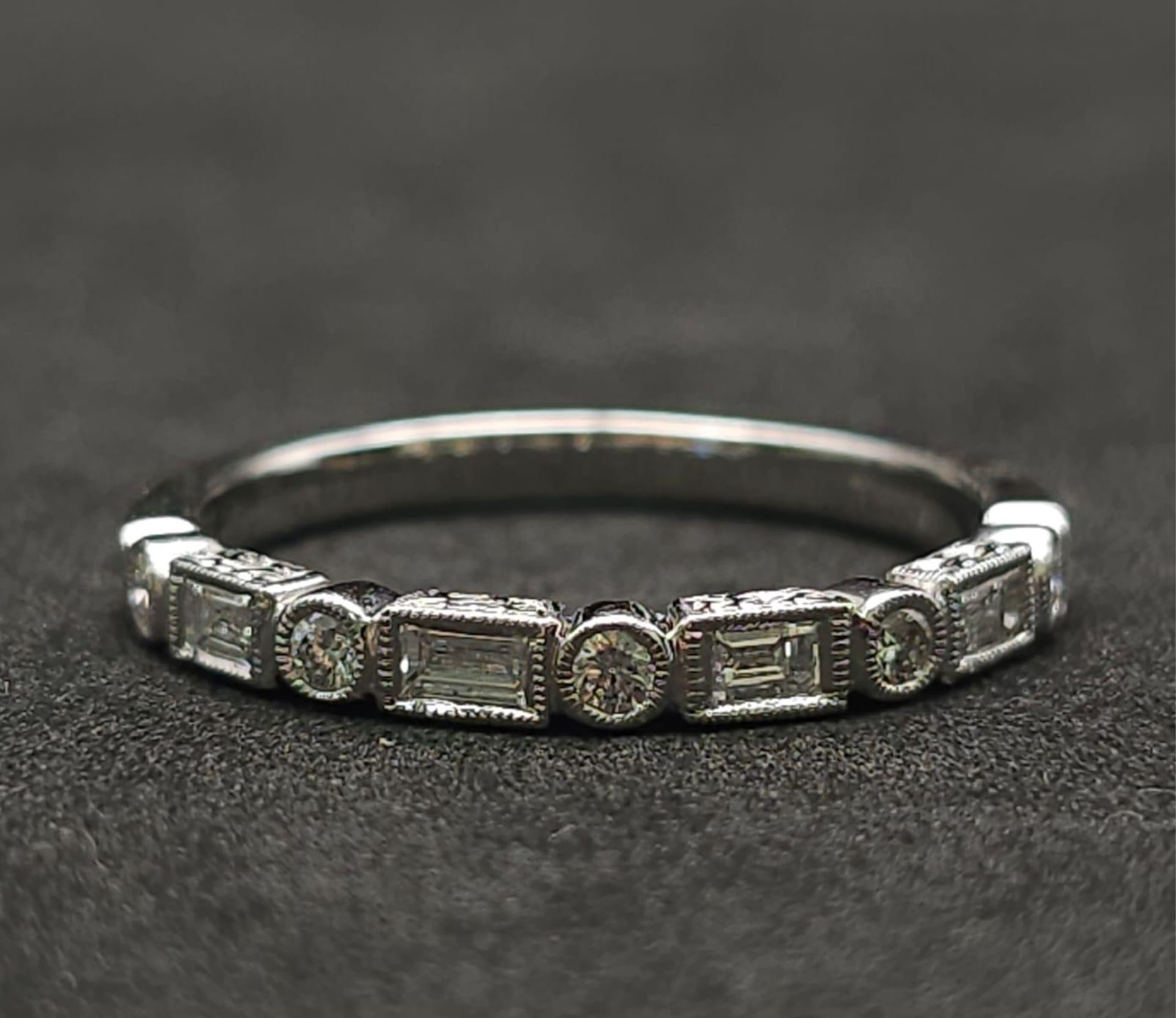 A 9K White Gold and Diamond Half Eternity Ring. Size N. 2g total weight. - Image 4 of 7