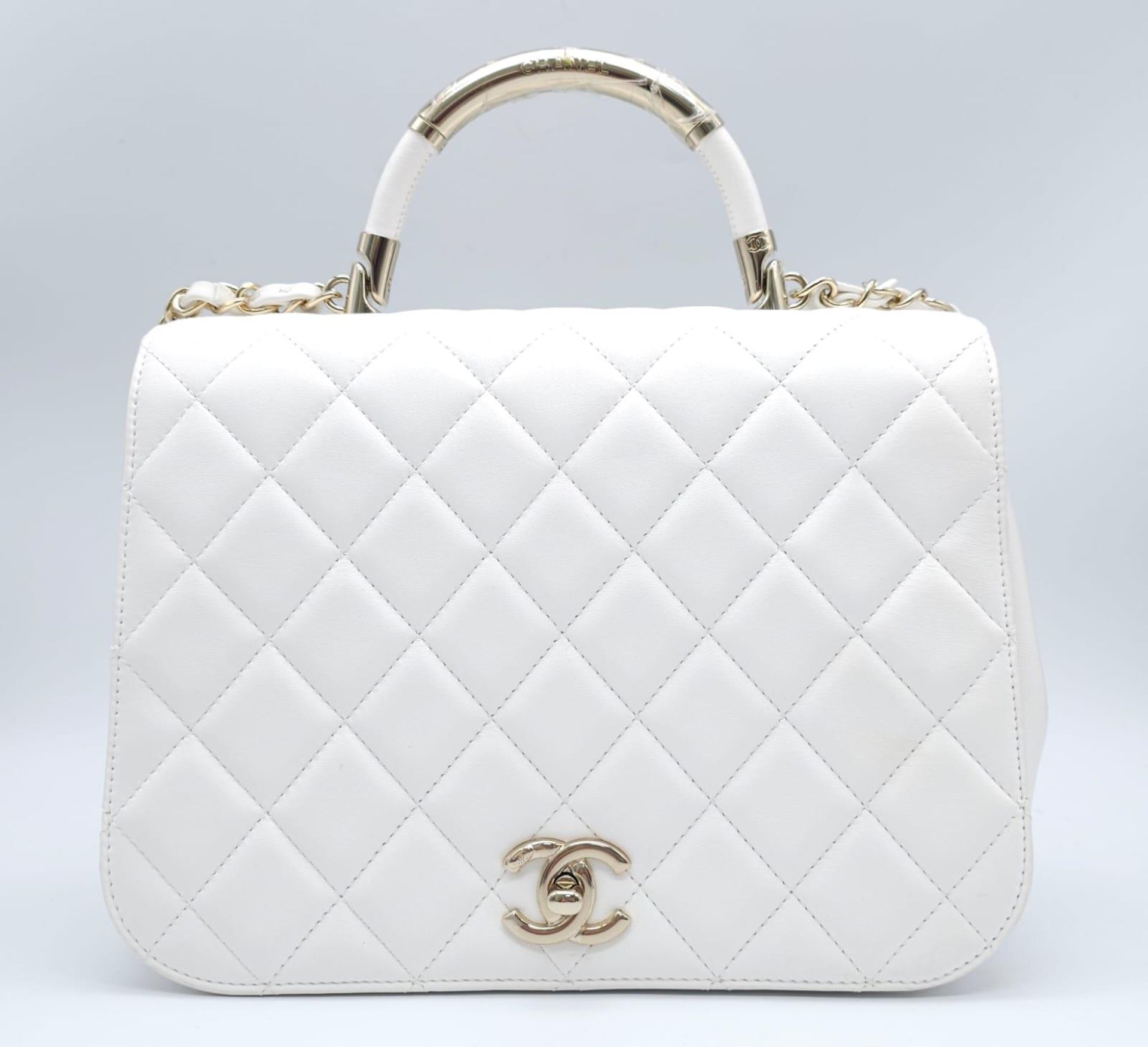 Chanel Carry Chic Bag. Lamskin throughout, front single flap is quilted with diamond stitching.