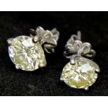 A FABULOUS PAIR OF PLATINUM CLAW SET DIAMOND STUD EARRINGS WITH OVER 1ct OF QUALITY SPARKLING