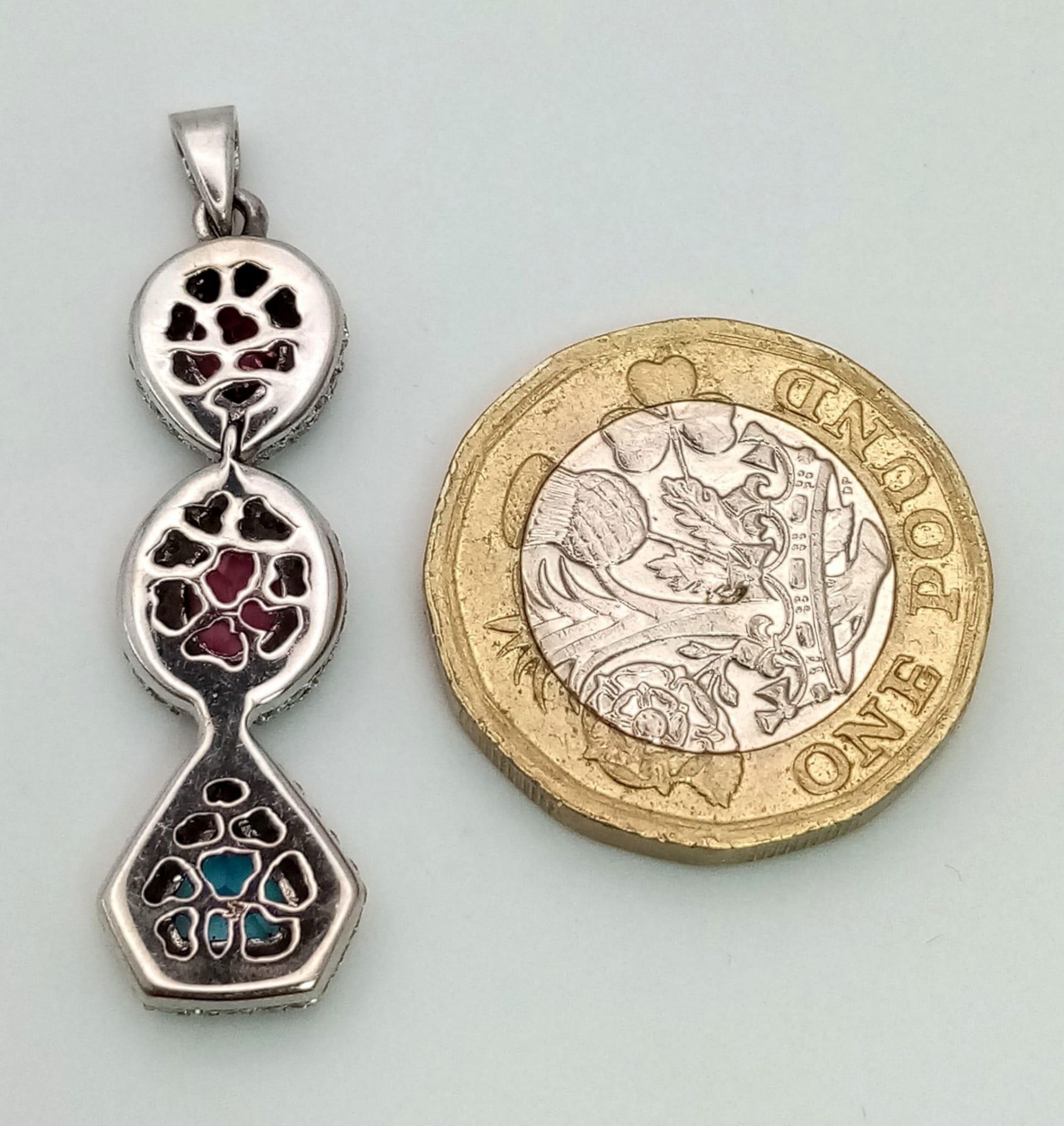 An 18K White Gold (tested) Ruby, Diamond and Topaz Drop Pendant. Three gemstones with diamond - Image 5 of 6