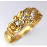 A Vintage 18K Yellow Gold Diamond Wave Ring. 0.5ctw of graduated diamonds in a scrolled wave