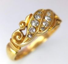 A Vintage 18K Yellow Gold Diamond Wave Ring. 0.5ctw of graduated diamonds in a scrolled wave