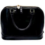 An Aspinal Black Hepburn Bag. Patent leather exterior with rolled leather handles, gold toned