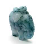 A Beautiful Chinese White Jade Elephant with Splashes of Blue and Green Pendant. 5cm x 4cm.