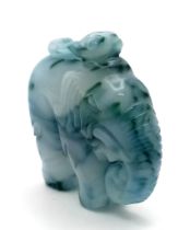 A Beautiful Chinese White Jade Elephant with Splashes of Blue and Green Pendant. 5cm x 4cm.