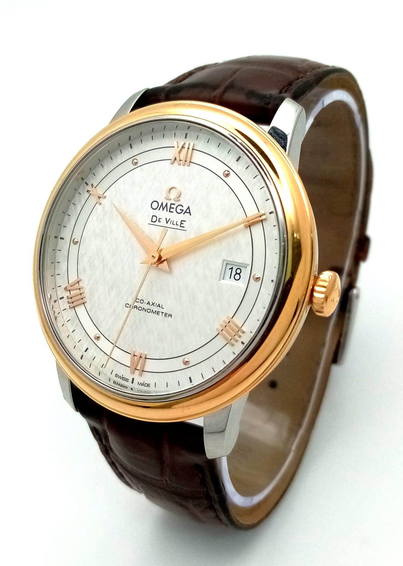 An Omega Deville Prestige Co-Axial Gents Watch. Brown leather strap. Gilded stainless steel case -