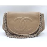 A Chanel Taupe Half Moon Flap Bag. Caviar leather exterior with diamond quilting through the base