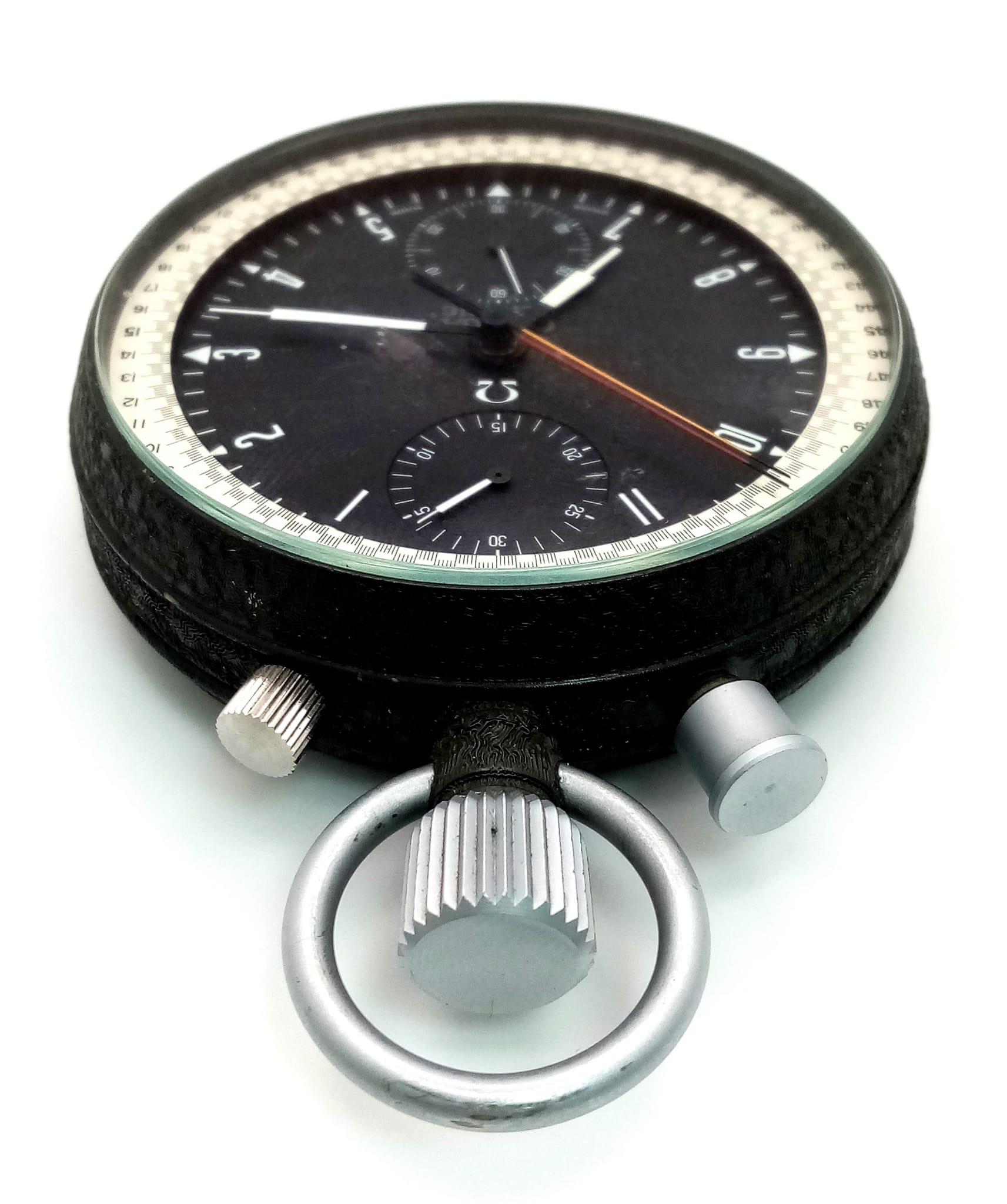 A Rare Vintage Omega Olympic Stopwatch. Top-winder. Black dial with three sub dials - minutes, - Image 3 of 4