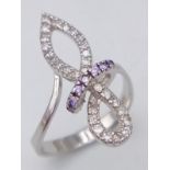 A 18K white gold CZ set elegant knot ring, 3.9g, size O