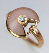 An 18 K rose gold CARTIER ring with a rose quartz and diamond pendant style top. Size: M, weight: