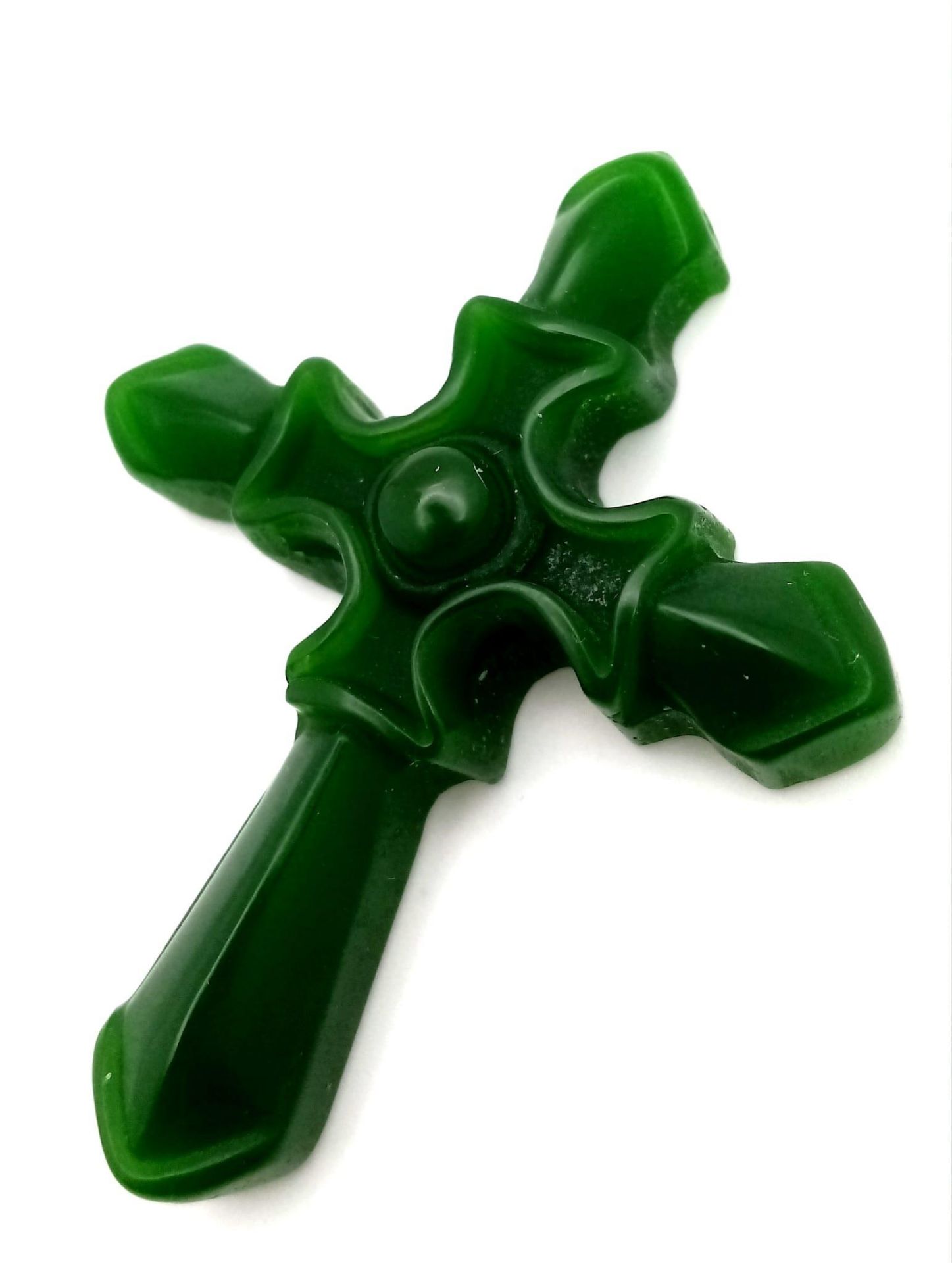 A Decorative Green Jade Cross Pendant. 5cm x 3.5cm