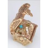 A very detailed 9 K yellow gold treasure chest charm which opens to reveal the treasure! Dimensions: