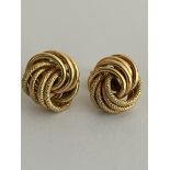 Beautiful pair of 9 carat ‘WOOLMARK’ KNOT GOLD EARRINGS. Complete with 9 carat gold backs. Full UK