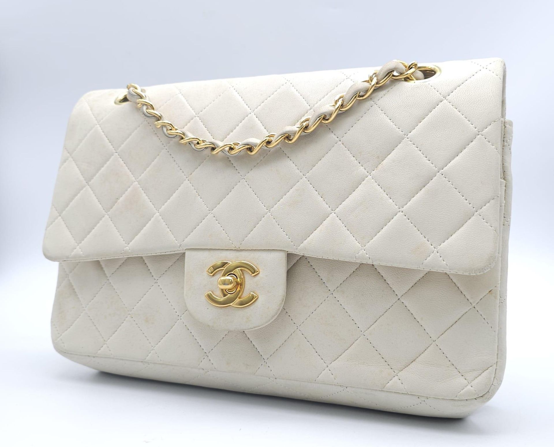 Chanel Cream Maxi. Double handled, quilted in diamond stitching and quality leather throughout. Gold