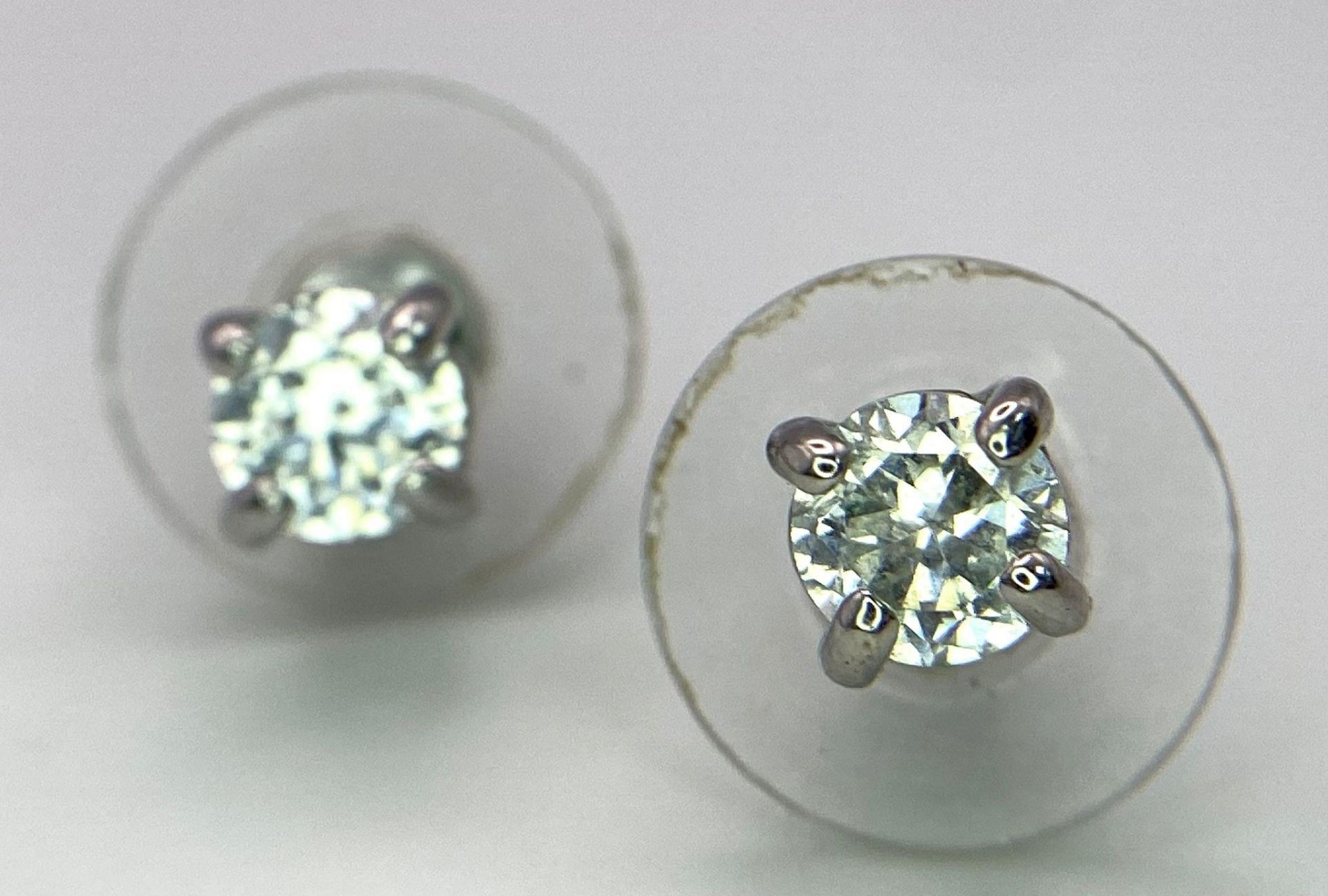 A Pair of White CZ Stone Stud Earrings.