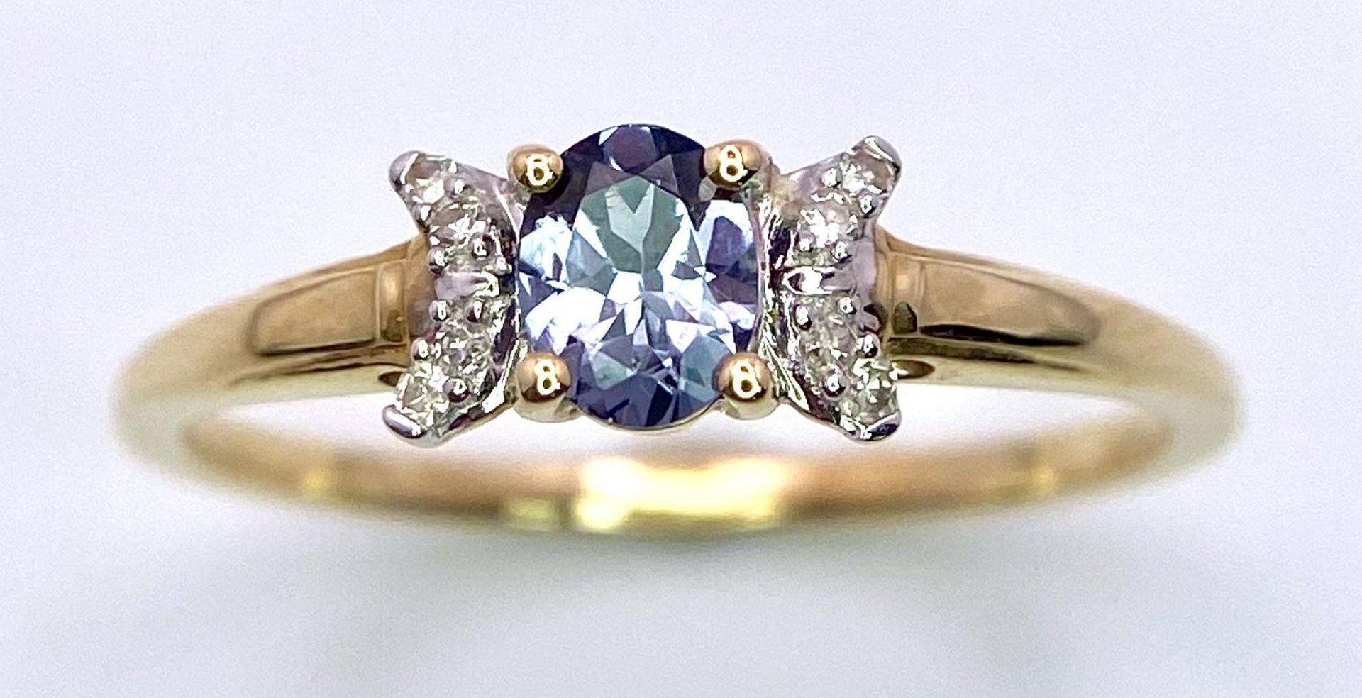 A 9K Yellow Gold, Blue Spinel and Diamond Ring. Spinel - 0.36ct. Diamond - 0.040ctw. Comes with a - Image 2 of 7