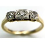 A 18kt Yellow Gold Ring with Trio of Diamonds. Each of the three Diamonds are mounted and framed