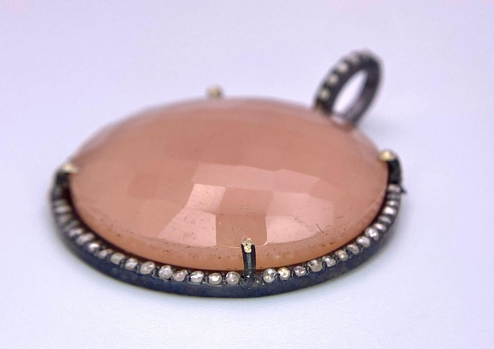 A Circular Rose Quartz and Diamonds Pendant. Faceted rose quartz cabochon with a diamond halo and - Image 2 of 9