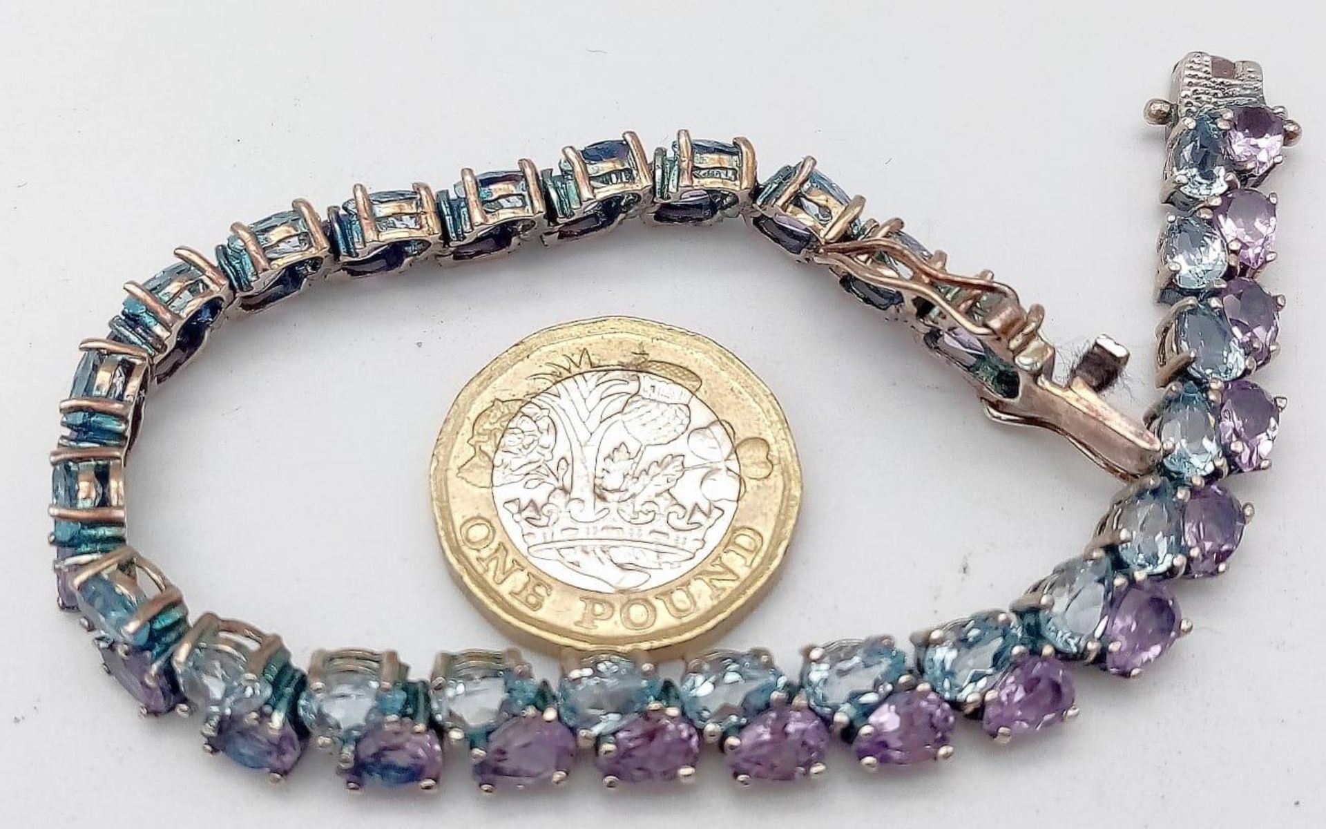 A Sterling Silver, double row bracelet set with Amethyst and Topaz. Measures 20cm in length. Weight: - Image 2 of 10