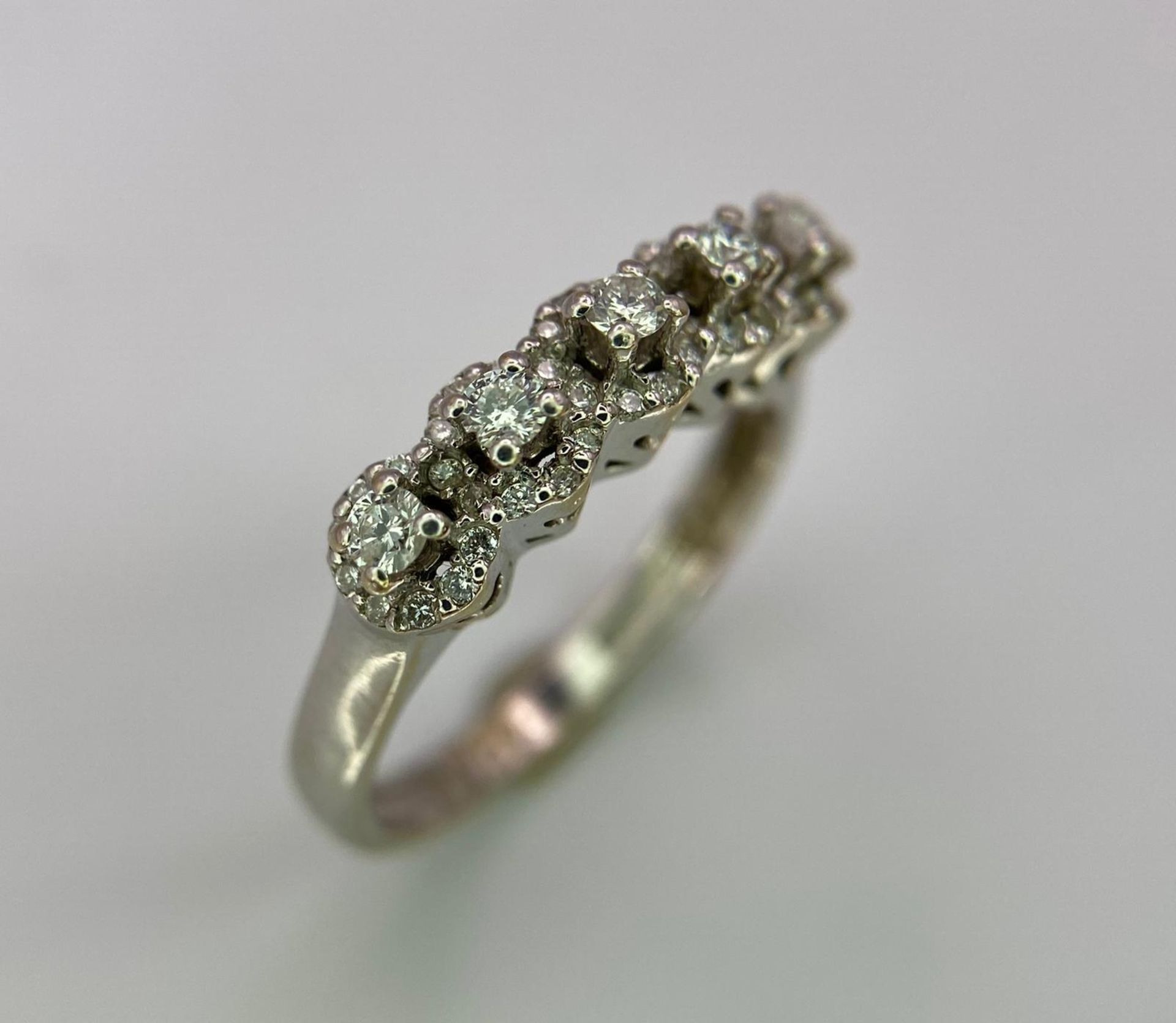 A Vintage 18K White Gold Five Stone Diamond Ring. Five brilliant round cut diamonds each with its - Image 2 of 4