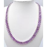 A Purple Haze of Marquise Shaped Amethyst Gemstones Creating a Stunning Tennis Necklace. Set in