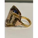 A unique 22 carat GOLD DESIGNER RING Having a large (25 carat) SMOKY QUARTZ set to top in an