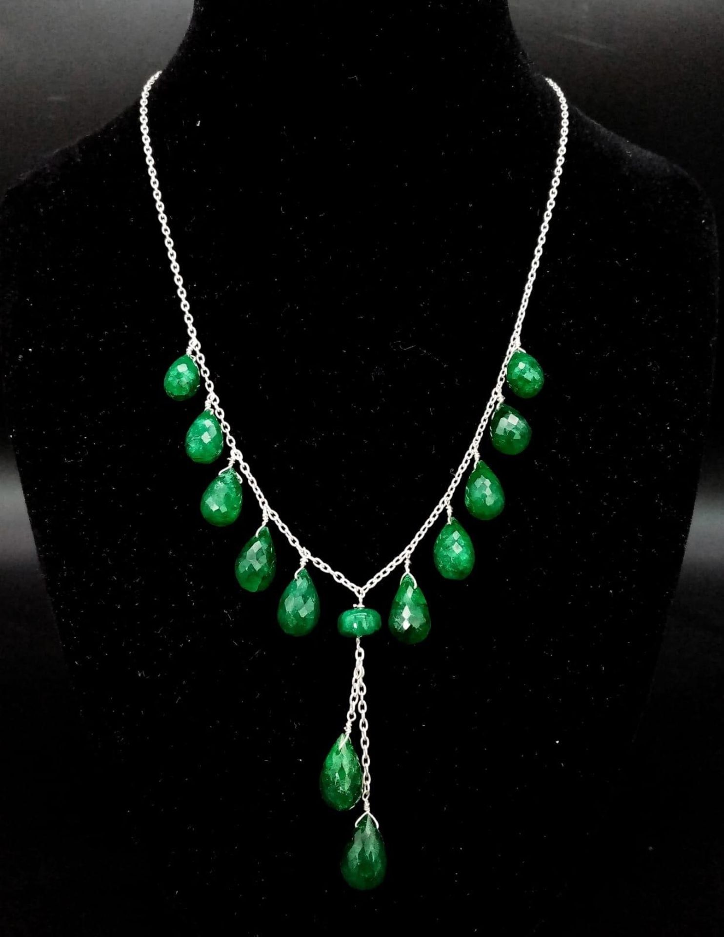 A 925 Silver Necklace with Briolite Cut Emerald Drops. 44cm in length, 5.5cm middle drop, 77ctw