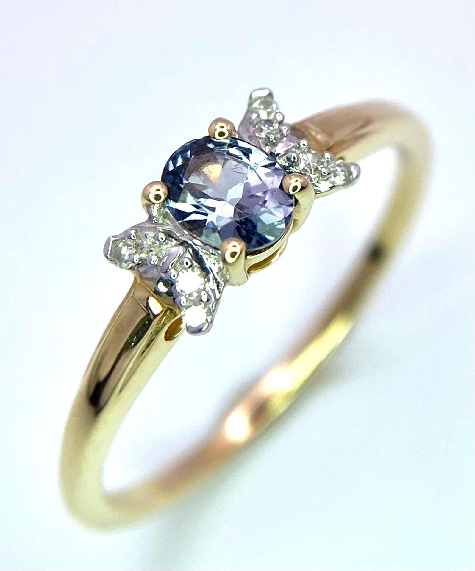 A 9K Yellow Gold, Blue Spinel and Diamond Ring. Spinel - 0.36ct. Diamond - 0.040ctw. Comes with a