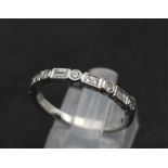 A 9K White Gold and Diamond Half Eternity Ring. Size N. 2g total weight.