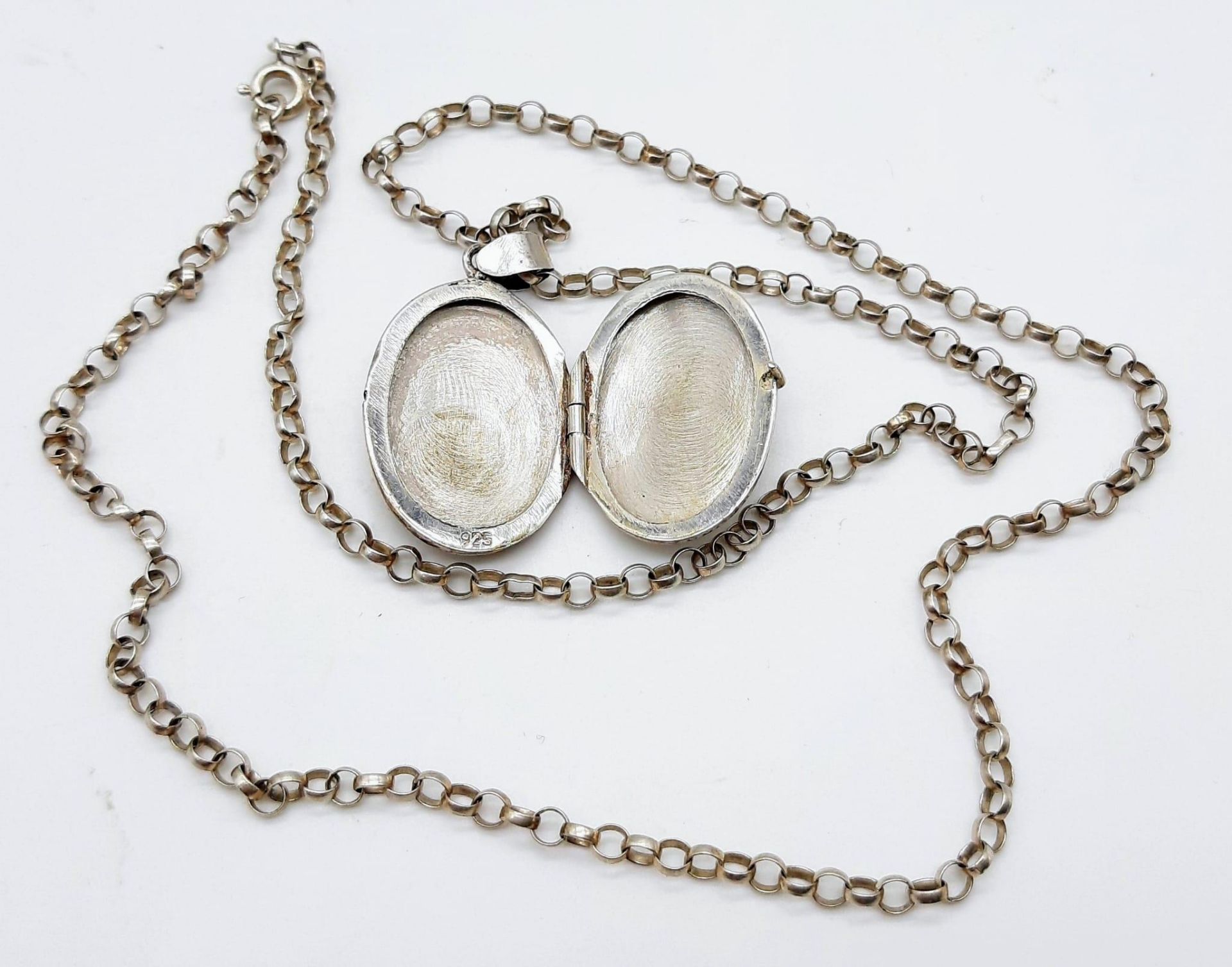 Collection of Sterling Silver Jewellery. Featuring an antique locket on chain (50cm), a stunning