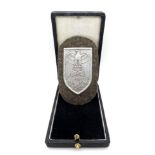 WW2 German Heer (Army) Cholm Campaign Shield in presentation case. Silvered Steel (Magnetic).