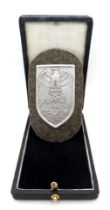 WW2 German Heer (Army) Cholm Campaign Shield in presentation case. Silvered Steel (Magnetic).