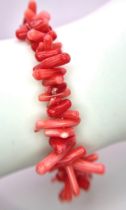 Pink/Red Coral Stretch Bracelet. Various sized coral pieces, pieced together to provide a fun,