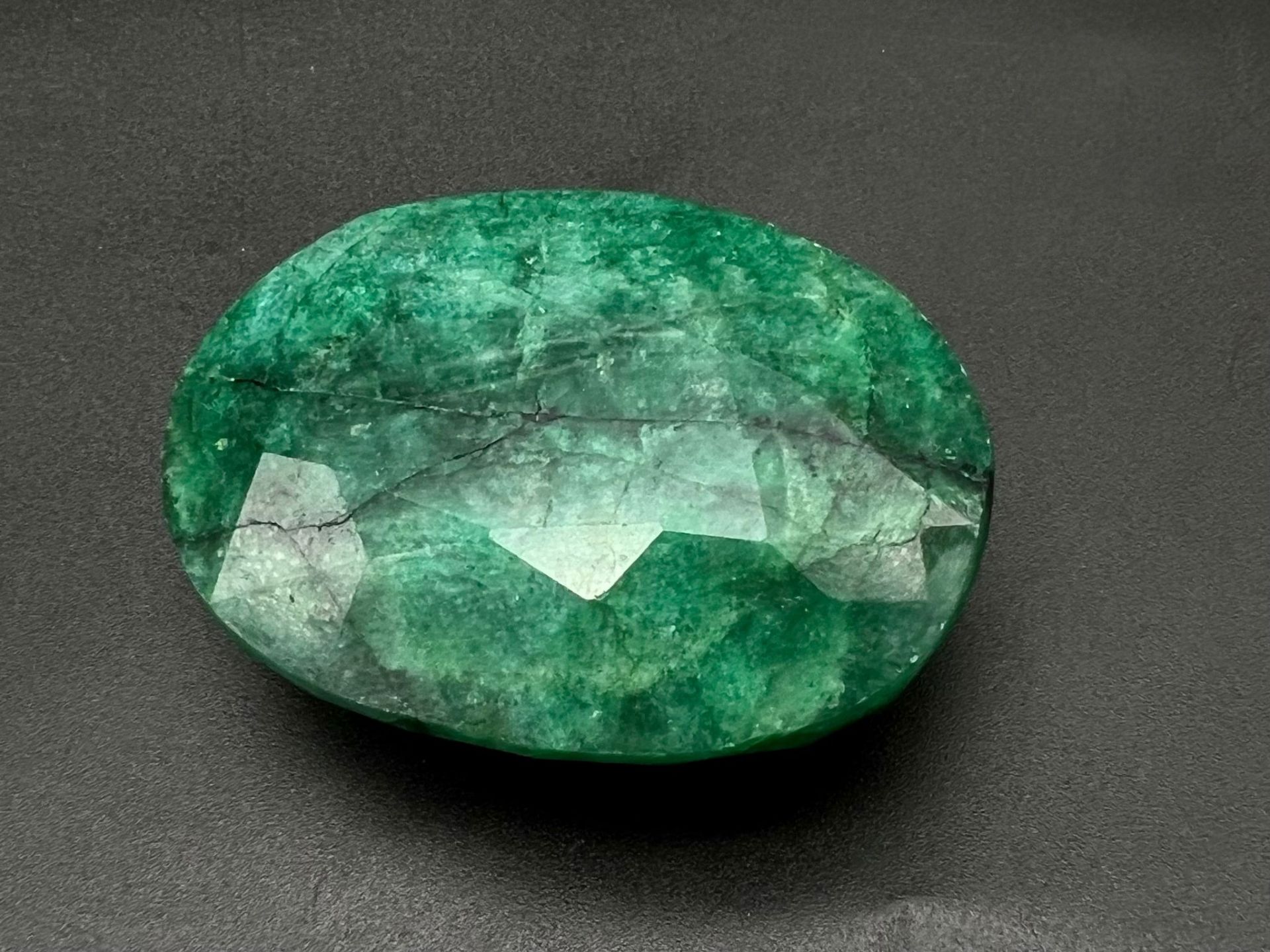 A 386.20ct Natural, Oval shaped, Earth Mined Emerald. Comes with GLI Certificate.