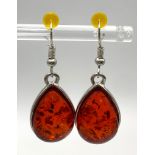 A Pair of Red Amber Resin Pear-Shaped Earrings.
