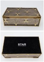 An unused 'Star' Julien Macdonald Jewellery Box. Gold tone 'Art Deco' patterning over a dark