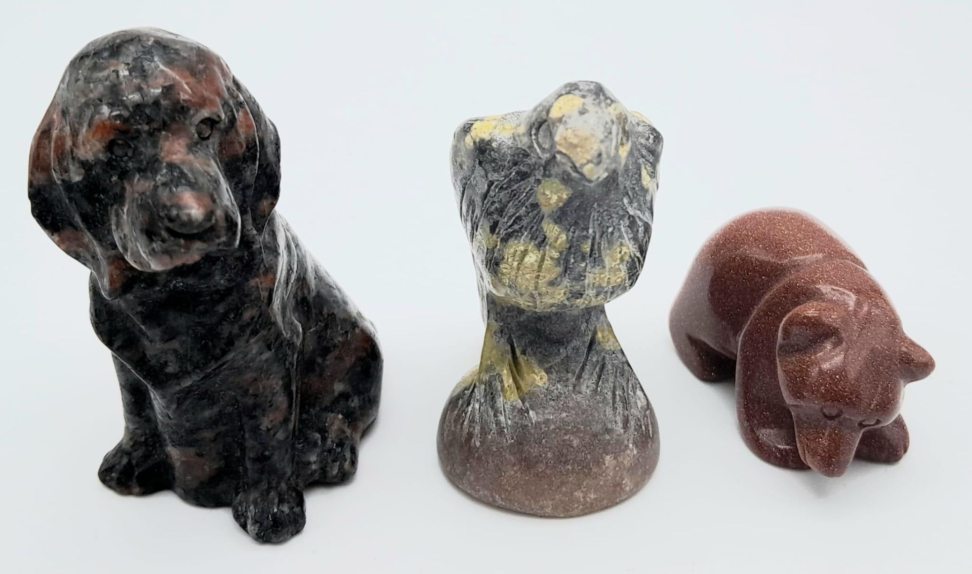 A trio of Stone Carved Animals. Featuring a Eagle, Dog and Bear. Various sizes, ranging within a