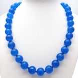 A Vibrant Blue Jade Bead Necklace. 12mm beads. 44cm necklace length.