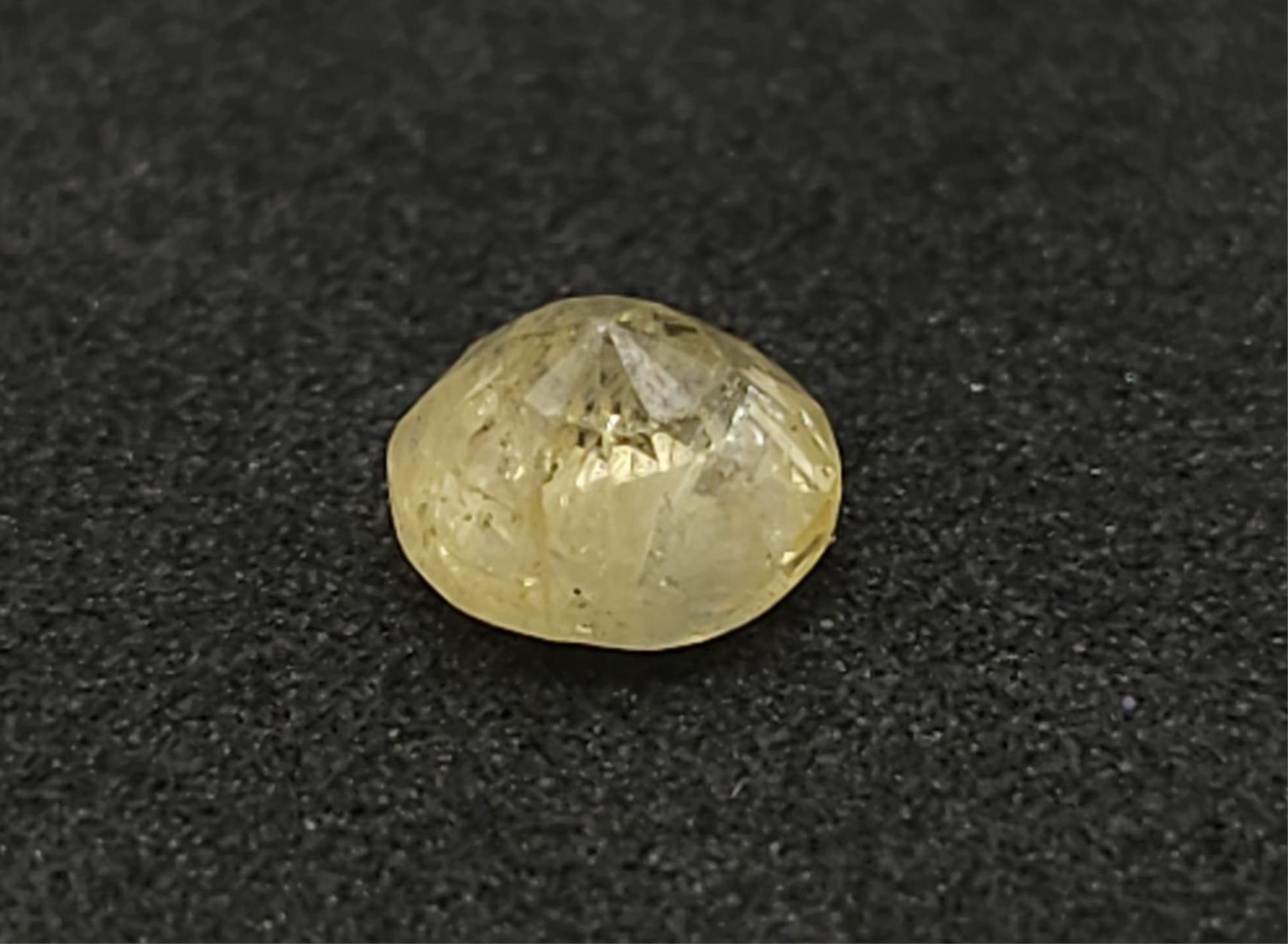 A 1.36ct Natural Madagascan Yellow Sapphire. AIG Certified. - Image 2 of 5