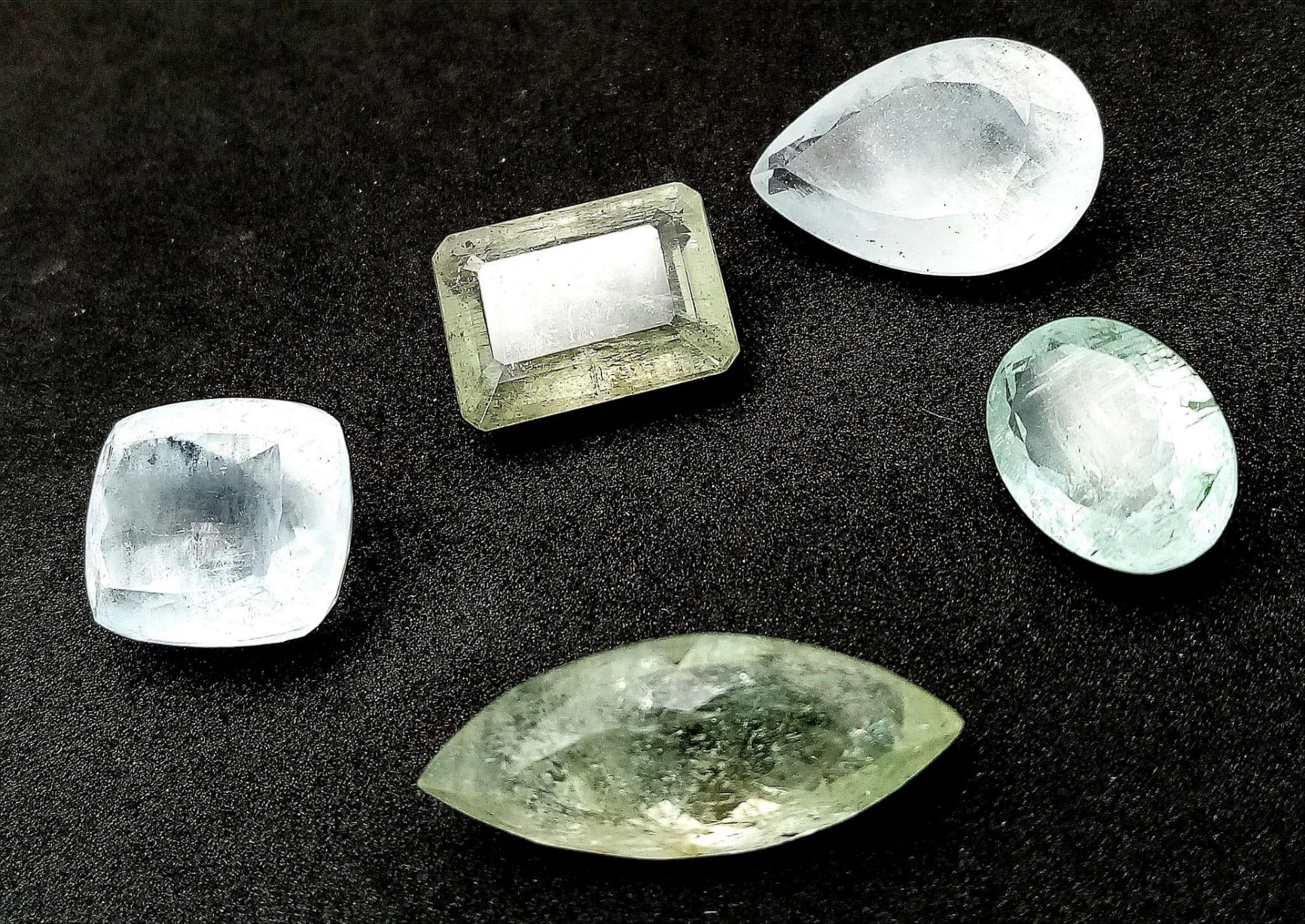 A Parcel of Five Aquamarine Gemstones - 67.5ctw. Different shapes.