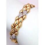 An 18K Yellow Gold and Diamond Ladies Bracelet. Rich gold droplets of 18k gold interspersed with