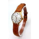 A Lovely Vintage 18K Gold Cased Tissot Ladies Watch. Brown leather strap. 18k gold inner