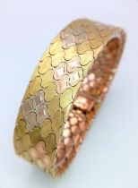An Italian 18K Gold Tri-Colour Bracelet. An incredible piece of craftmanship with diamond mesh